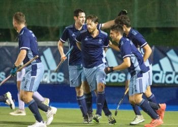 Daniel Cox (partially hidden) accepts the congratulations of his teammates Picture: Helen Ritchie