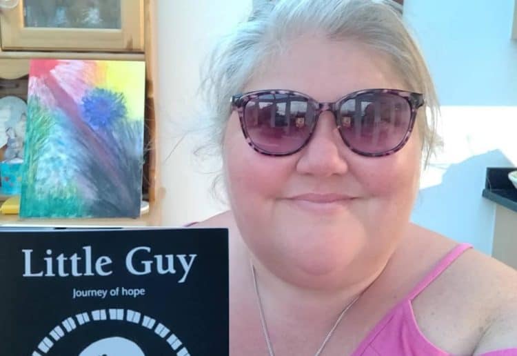 Emma Major with her Little Guy book