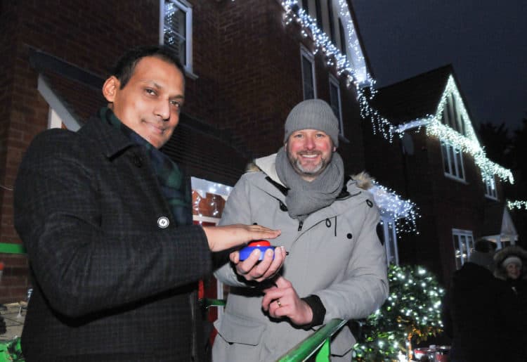 Maybank lights switch on in Shinfield on Sunday evening

Duke Ahmed (who is being treated for throat cancer) switches the lights on watched by Liam Murray (organiser).