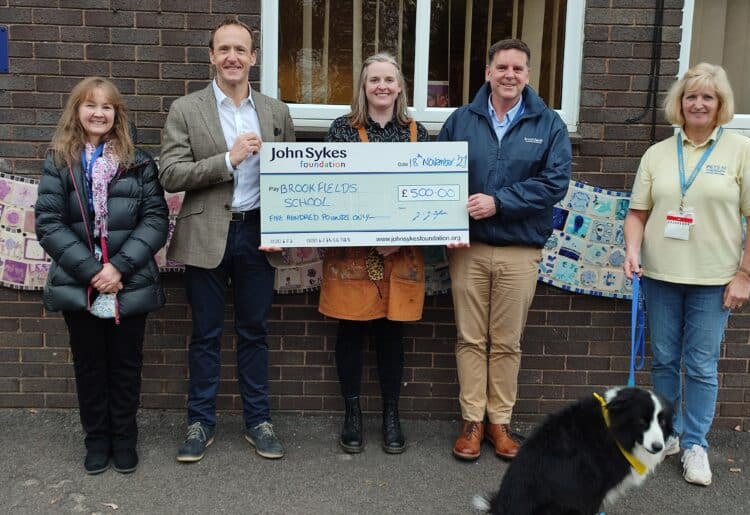 John Sykes, Founder & Chair of Trustees, Brandon Mills, Headteacher, Charlotte Wilshire Fundraiser, and Heather Beeney, Arts Teacher, alongside Ione Stacey and Bali the Therapy Dog from Pets as Therapy, a monthly visit which the Foundation fund