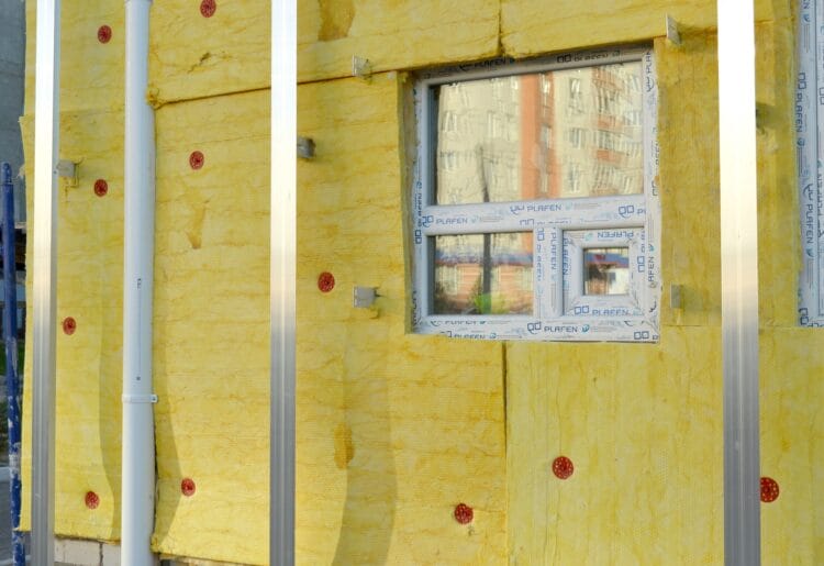 Insulation being installed in a home