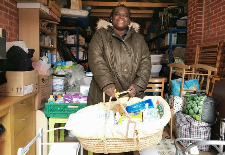 Josimah Baby Bank's founder Buki Adedoyin-Benson, with a newborn bundle assembled from new and donated items Picture: Natalie Burton