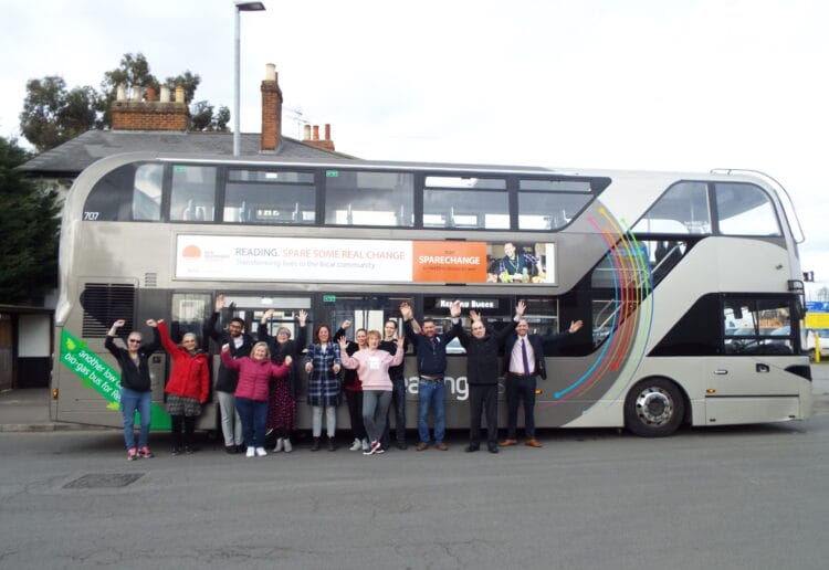 Members of Reading Buses and New Beginnings, including volunteers, in front of the branded bus