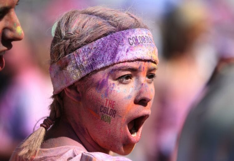A runner covered in powder paint at a colour run event in London Picture: Jordane Mathieu on Unsplash