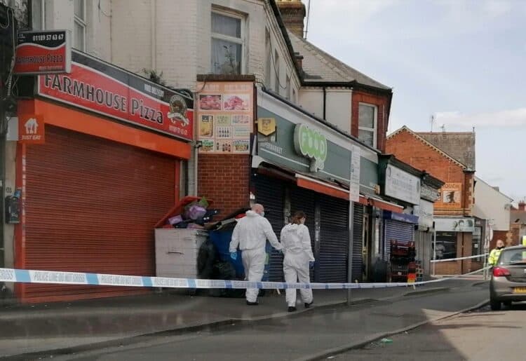 Forensic police on duty on Reading's Oxford Road Picture: Steve Smyth