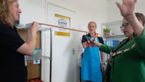 Cllr Debs Edwards cutting the ribbon at the Norcot Pantry Launch Event