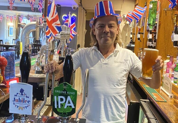 Dave Rigg, landlord of The Roebuck, raises his 6p pint to the Queen Picture: Phil Creighton