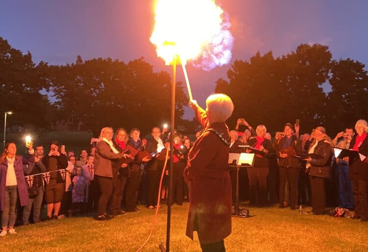 The mayor, Cllr Janet Sartorel, lights the beacon in Woodford Park, Woodley Picture: Phil Creighton