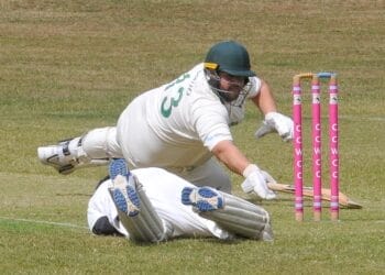 Crowthorne & Crown Wood 2s (batting) v Farley Hill 2s Mike Brundish narrowly avoids being out as Farley Hill wicketkeeper, Sanjay Gurung to stump him out.
