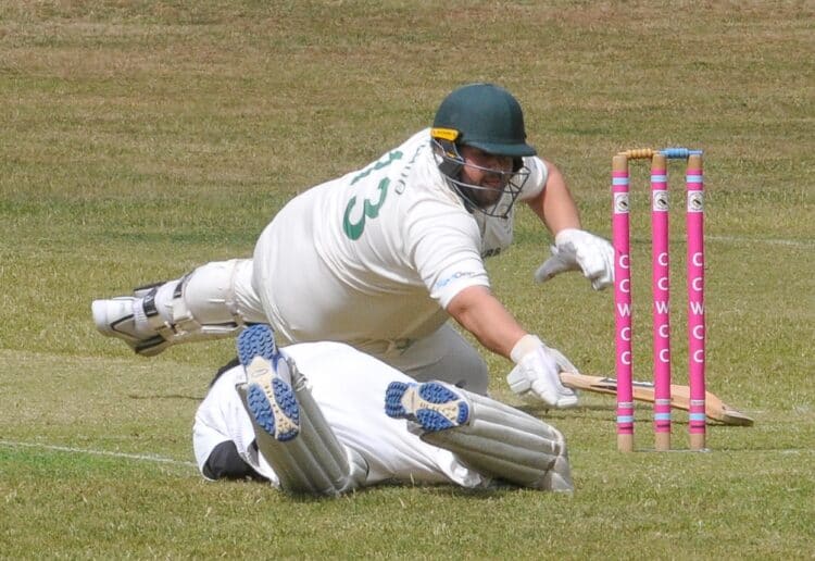 Crowthorne & Crown Wood 2s (batting) v Farley Hill 2s Mike Brundish narrowly avoids being out as Farley Hill wicketkeeper, Sanjay Gurung to stump him out.