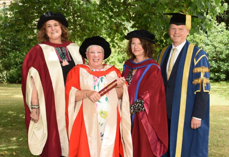 HONOURED: (From left) Prof Carol Fuller, Head of Institute of Education; Ms Trisha Bennett; Dr Sally Lloyd-Evans, Public engagement research fellow; Dr Robert Van de Noort, Vice-Chancellor were in attendance to see Ms Bennett receive her honorary degree. Picture courtesy of the University of Reading