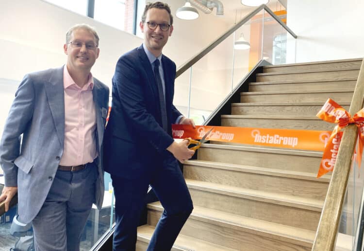 InstaGroup?s David Robson watches as Bristol North West MP Darren Jones cuts the ribbon to open the new InstaGroup HQ in Hogwood Industrial Park in Finchampstead Picture: Phil Creighton