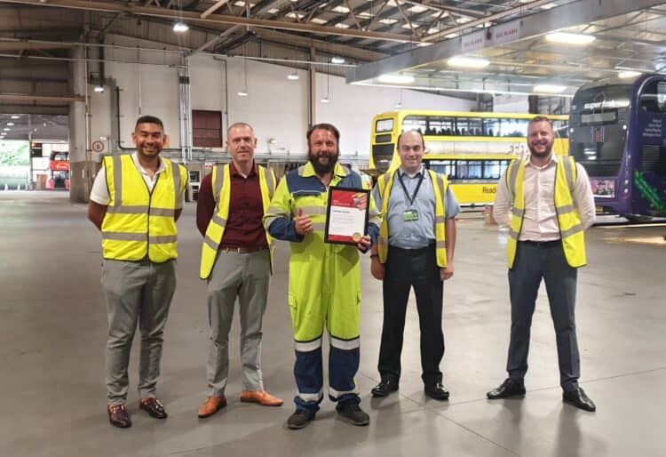 Andy Gordon receives his Star of the Month award from Reading Buses
