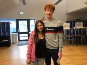 Beatriz Bruscato and Tom Phillips collecting GCSE results
