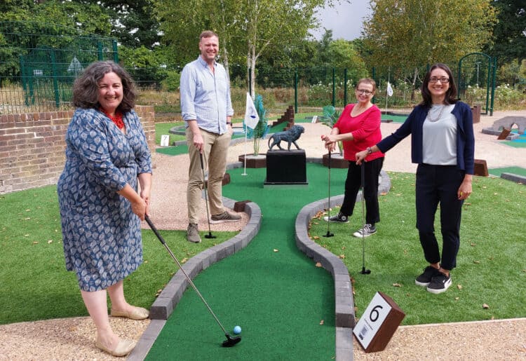 Councillors try their hand at the new mini-golf course at Prospect Park. Each hole has a Reading landmark in it, including The Fobury Lion Picture: Reading Borough Council
