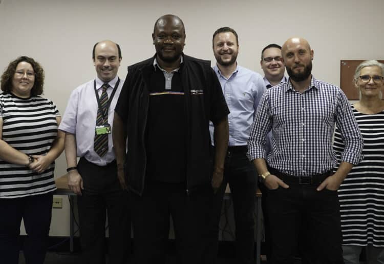 Oliver Saunders, third from left, has served 20 years at Reading Buses, and was commended for the milestone. Picture: Courtesy of Reading Buses