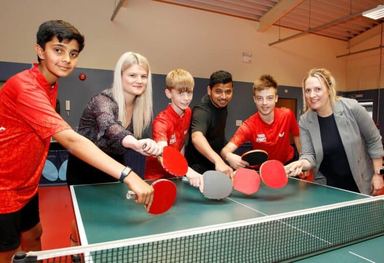 Kingfisher Table tennis Club players Prayrit Ahluwalia (far left), Harry Randall and Jamie Barlow with head coach Ajay Naik with Alix Laflin (marketing manager for Vistry Thames Valley) and Lycee Marsh (marketing assistant at Vistry Thames Valley)