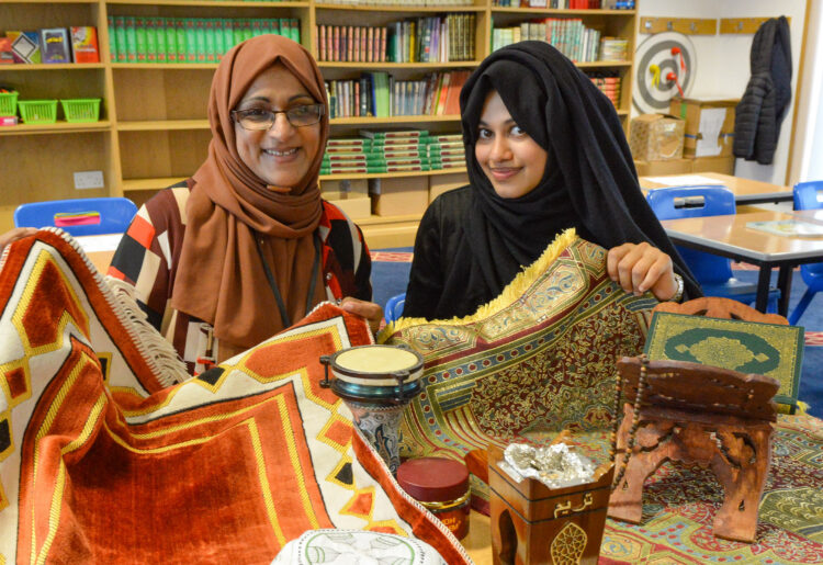 Shazia Fazal and Salma Khan with some of the items used for religious practises at the Mosque. Picture: Steve Smyth