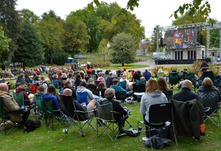 The Funeral Service of the Queen on a large screen in the Forbury Gardens.