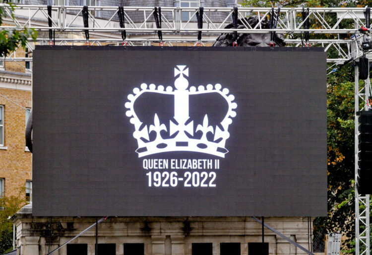 The Funeral Service of the Queen on a large screen in the Forbury Gardens.