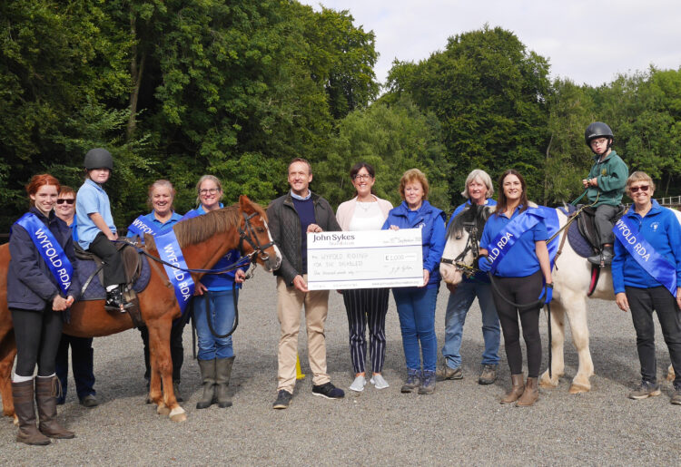 John Sykes, Founder & Chair of Trustees, myself, James Marsh, Alice Dunton, both riders aged 9, Kim Fry Trustee and a number of volunteers from WRDA