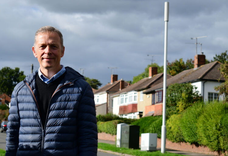 Matt Rodda standing at the current 8 metre tall 4G Mast on the grass verge outside 94 Chiltern Road in Caversham. Credit: Office of Matt Rodda MP