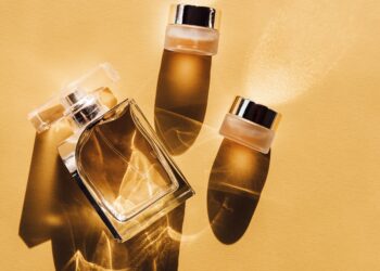 Three bottles of perfume lay on a golden yellow background. Picture:Birgith Roosipuu via US