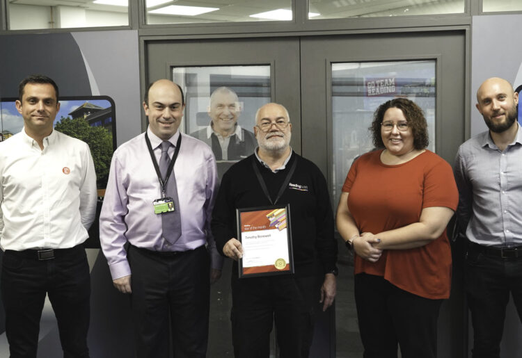 Tim Bonewell receives his Star of the Month award from Reading Buses