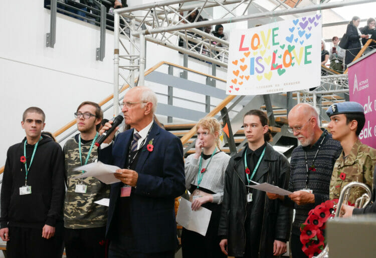 Mike Penny leads the act of remembrance at Reading College