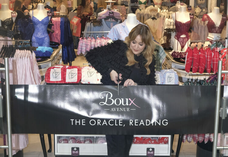 Chief designer Zoe cuts the ribbon to celebrate the opening of the new shop in Reading's Oracle shopping centre. picture courtesy of Boux Avenue