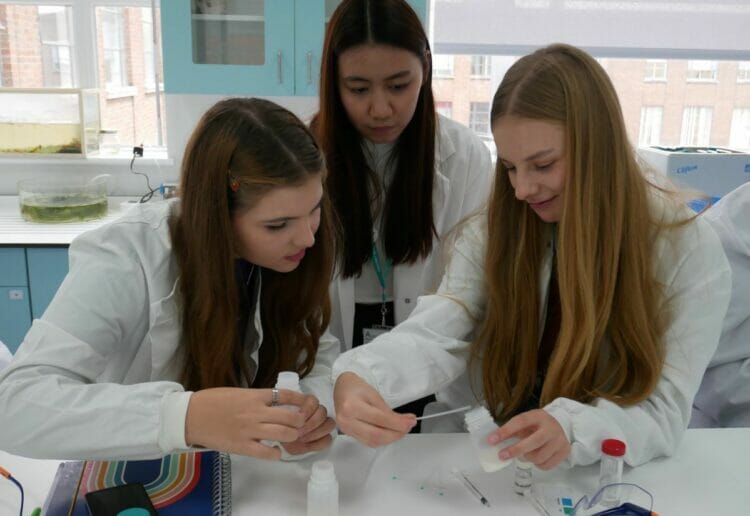Nastya, Sin Yan and Polina do the milk mix-up tests. Picture courteys of Active Learning