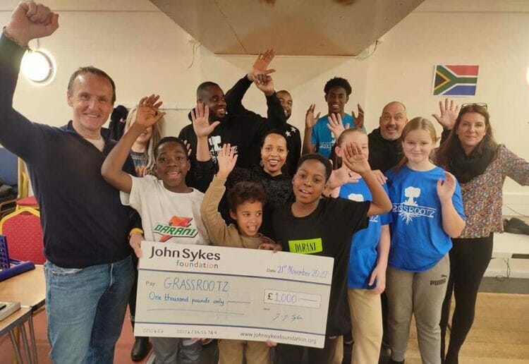John Sykes from the John Sykes Foundation visited Grassrootz to present them with a covid grant