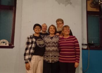 Finalists (front row, from left) Aishwarya Mahajan, Sarah Smith, and Liz Teo, with organiser Richard Stephenson, back left, and host A.F. Harrold, back right. Picture: Jake Clothier