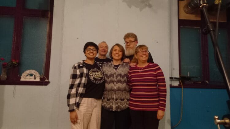 Finalists (front row, from left) Aishwarya Mahajan, Sarah Smith, and Liz Teo, with organiser Richard Stephenson, back left, and host A.F. Harrold, back right. Picture: Jake Clothier