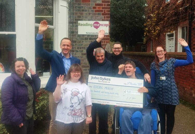 Reading Mencap members with John Sykes celebrating a covid-19 grant from the charitiable foundation