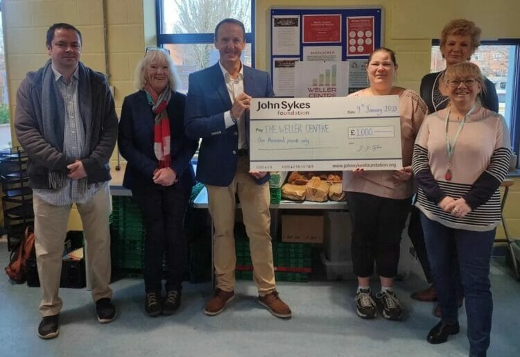 John Sykes presents a grant to The Weller Centre in Caversham