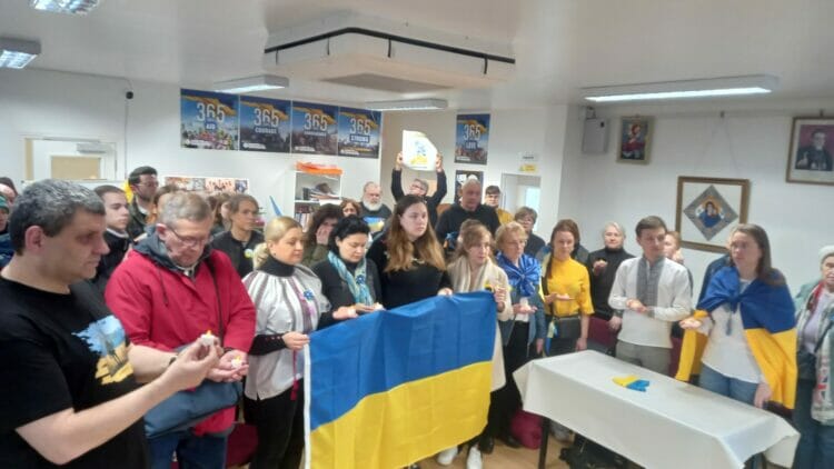 Reading's Ukrainian community marking the minute's silence at Reading Ukrainian Community Centre. Picture: Jake Clothier