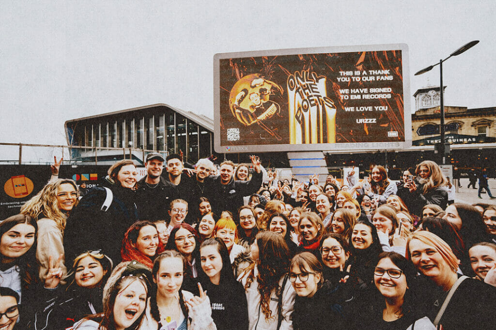 Fans joined the band ahead of the show for a photo opportunity with the billboard announcing the band's signing to EMI Records. Picture: Jordan Daniel Logan, by courtesy of Chuff Media