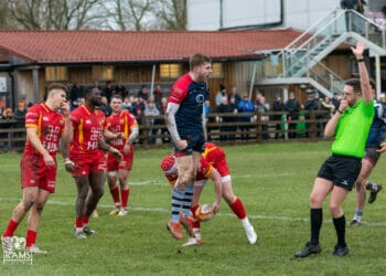 Will Partington celebrates after scoring his side's fourth try