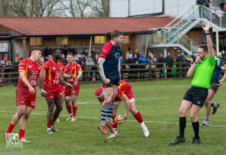 Will Partington celebrates after scoring his side's fourth try