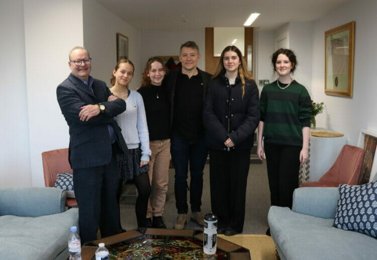 Ben Shephard, centre, joined staff and students at Queen Anne's School, and was taught drama by the school's current head of Drama, Rhodri Punter, left. Picture: Courtesy of Queen Anne's School