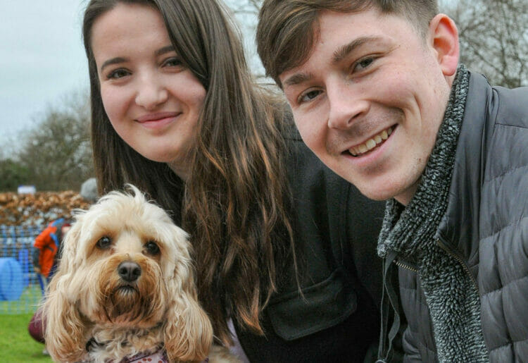 Jordan Vockins and Ben Groves celebrate the Pooch Party with Jessie and Benji. Picture: Steve Smyth