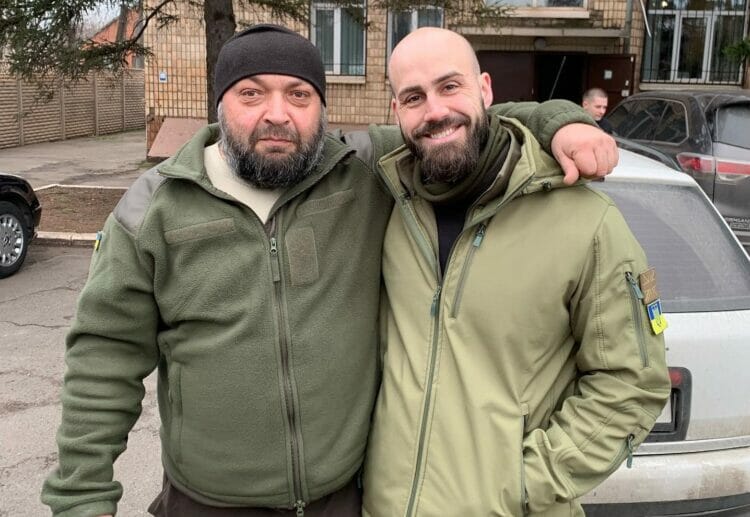 Nick Tenconi with a man during the Vans Without Borders mission to The Donbas region in Ukraine. Credit: Nick Tenconi