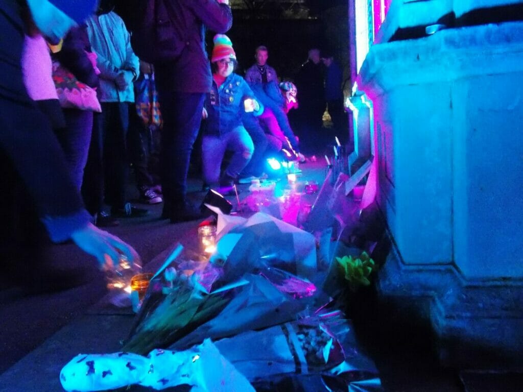Members of the public leaving tributes to Brianna at the vigil. Picture: Jake Clothier