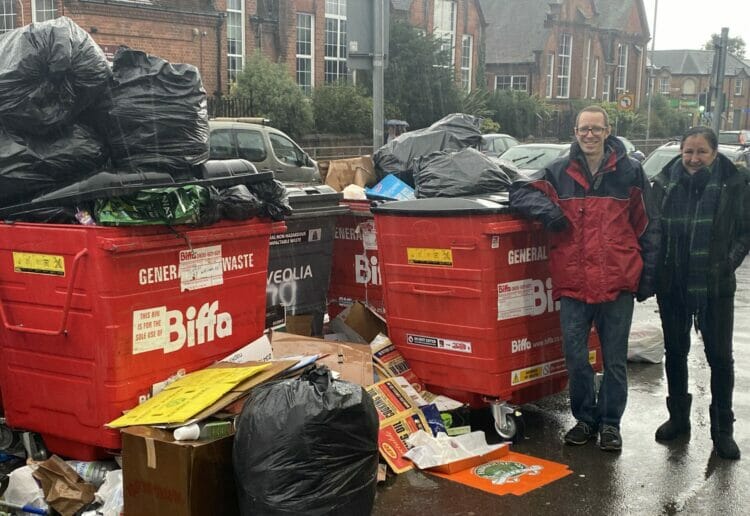 Cllr Rob White and Reading Green party campaigner Sarah Magon with the piles of rubbish and overflowing bins on Wokingham Road Pictures: Phil Creighton
