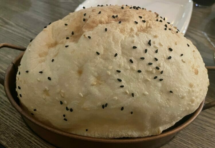 Freshly baked bread and goats' cheese crumble at La'De Kitchen Picture: Claire Nash