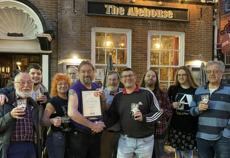 Members of CAMRA celebrate with The Alehouse's team Picture: Phil Creighton