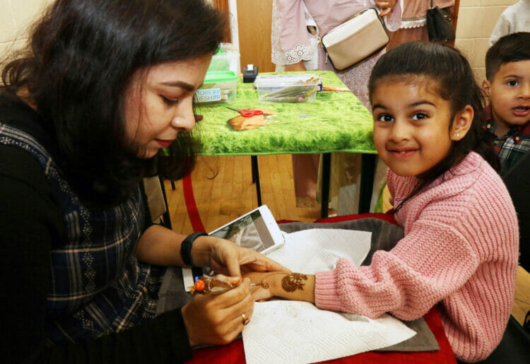 Aiza, 5, gets some henna done. Picture: Dijana Capan/DVision Images