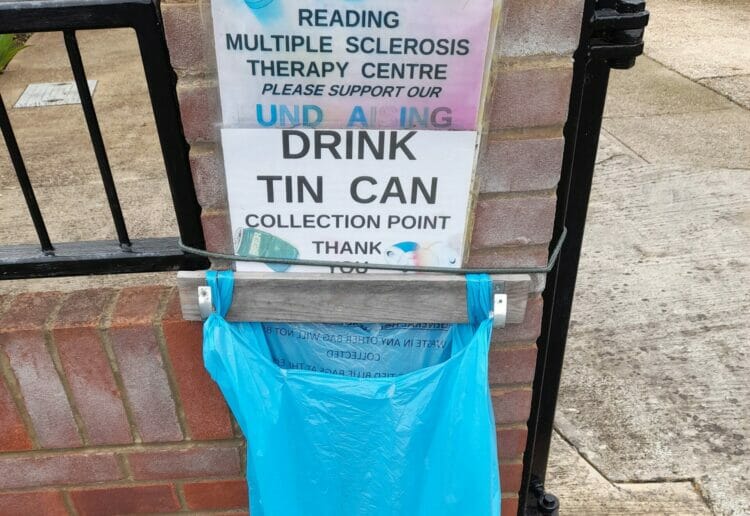On the gate of a house near where I live hangs a blue binbag full of empty drinks cans.