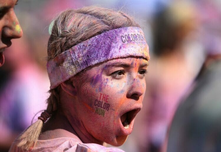 A runner covered in powder paint at a colour run event in London Picture: Jordane Mathieu on Unsplash